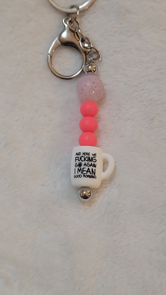 "and here we f*cking go again" bar keychain