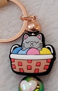 Kitty in a basket bar keychain